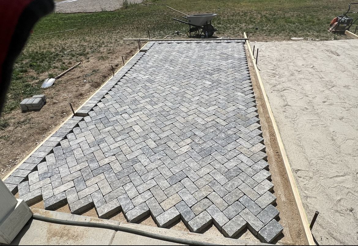 Natural stone cobblestone set in a herringbone pattern